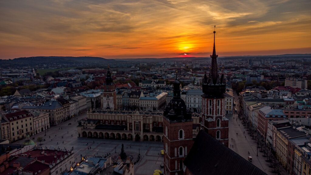 Aerial view of St. Mary's Church on a Main Square in Cracow, Poland at sunset Rynek Kraków