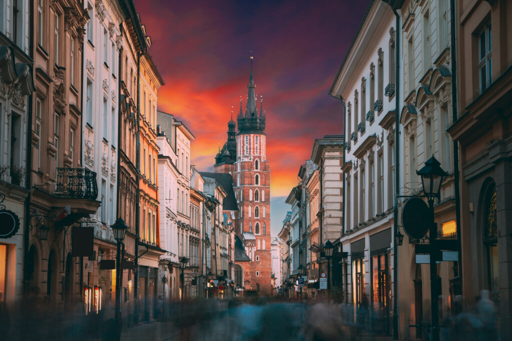Krakow, Poland. View Of The St. Mary's Basilica From Florian Street. Famous Landmark Old Landmark Church Of Our Lady Assumed Into Heaven. Saint Mary's Church Kościół Mariacki w Krakowie